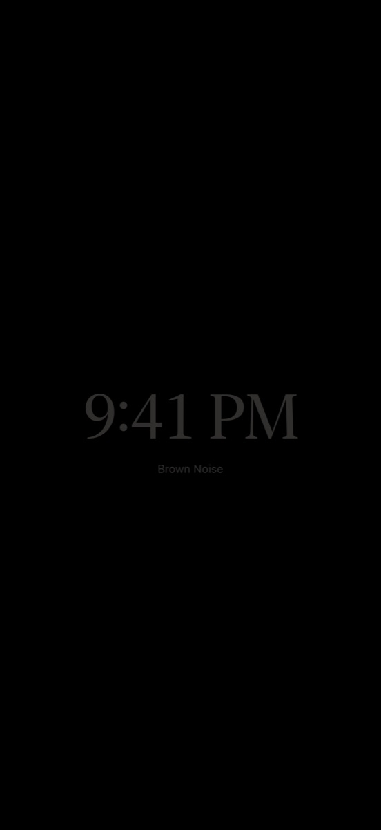 Pure black night screen with a dim clock